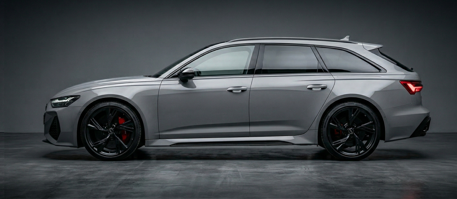 Silver Audi car on a dark gray background